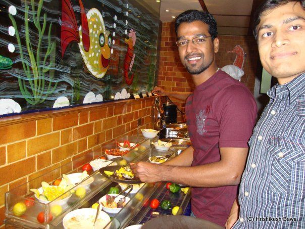 Friends having a go at the salads
